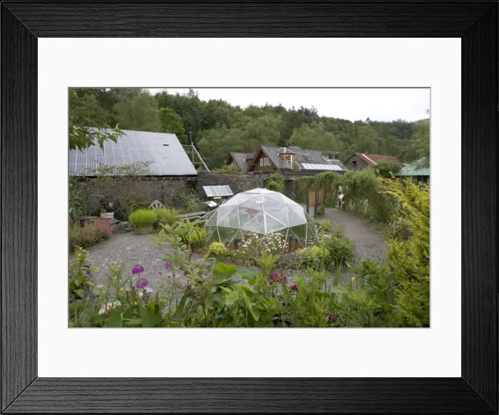 Framed Print : Centre for Alternative Technology, UK - situated in an old slate quarry at Machynlleth in Mid-Wales the centre demonstrates a wide range of sustainable systems. This image shows a greenhouse, low energy house and photovoltaic roof Framed Print : Centre for Alternative Technology, UK - situated in an old slate quarry at Machynlleth in Mid-Wales the centre demonstrates a wide range of sustainable systems. This image shows a greenhouse, low energy house and photovoltaic roof