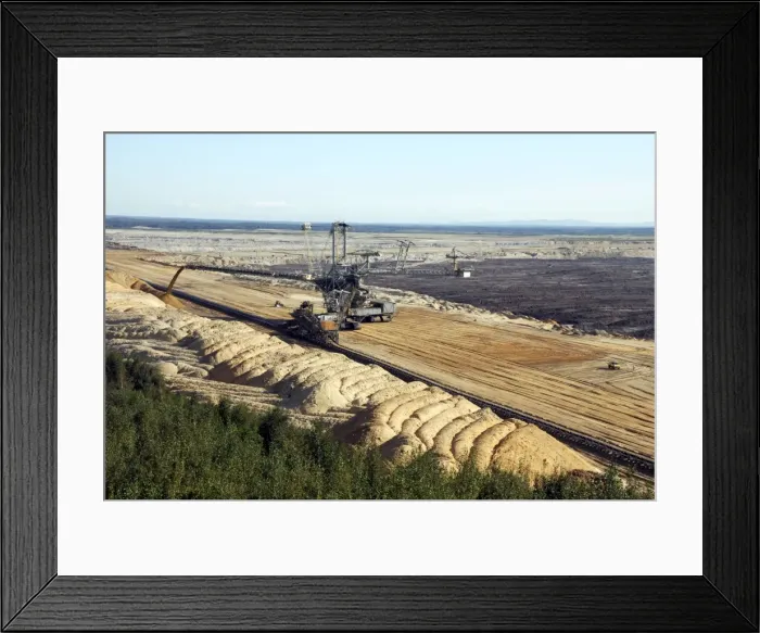 Framed Print : Vattenfall Europe Opencast brown coal (lignite) mine and simultaneous backfilling - near Weisswasser - Saxony NE Germany. (note the bulldozer in front of the big excavator for scale object)