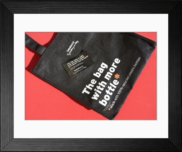 Framed Print : Re-use shopping bags made from old plastic bottles Sainsburys supermarket Cheltenham UK Framed Print : Re-use shopping bags made from old plastic bottles Sainsburys supermarket Cheltenham UK