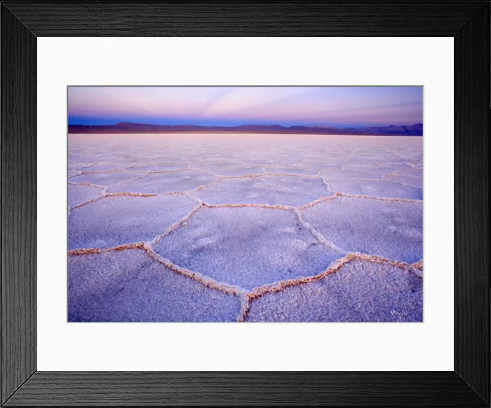 Framed Print : Salinas Grandes del Noroeste - mountains and dried-up salt lake showing a regular polygonal pattern created by salt crystals - at dusk - the salinas are located on an altitude of 3450 m above sea level on the so-called Altiplano - Prov Framed Print : Salinas Grandes del Noroeste - mountains and dried-up salt lake showing a regular polygonal pattern created by salt crystals - at dusk - the salinas are located on an altitude of 3450 m above sea level on the so-called Altiplano - Prov