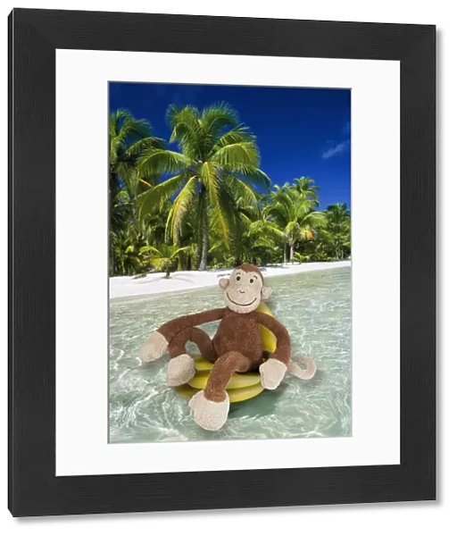 Monkey cuddly toy resting in tropical scene Digital Manipulation: Monkey (Su) - Bananas (LA) - Background (PM)