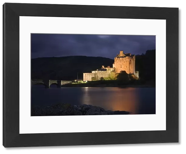 Eilean Donan Castle - being lit up at dusk - November - Scotland