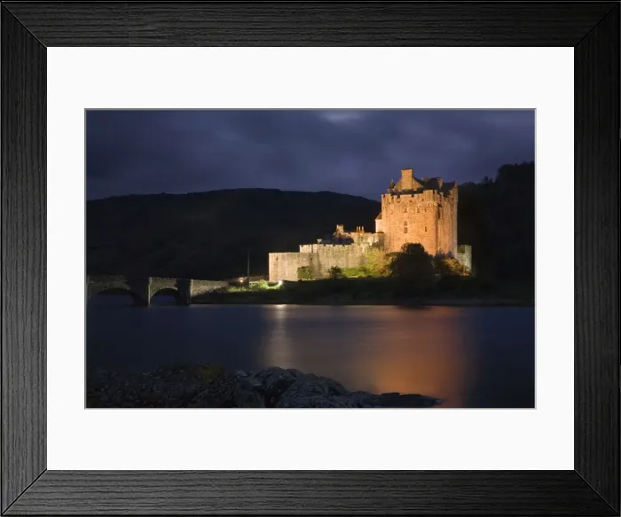 Framed Print : Eilean Donan Castle - being lit up at dusk - November - Scotland Framed Print : Eilean Donan Castle - being lit up at dusk - November - Scotland