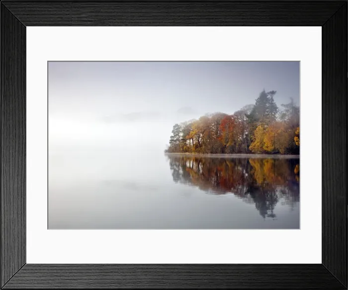 Framed Print : Derwent Water - autumn colours reflected in water of derwent island in the mist with catsbells just visable through the mist - Lake District - England Framed Print : Derwent Water - autumn colours reflected in water of derwent island in the mist with catsbells just visable through the mist - Lake District - England