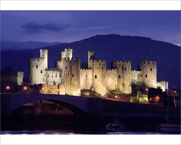 Conwy Castle - being lit up at dusk - November - North Wales - UK