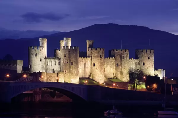 Conwy Castle - being lit up at dusk - November - North Wales - UK