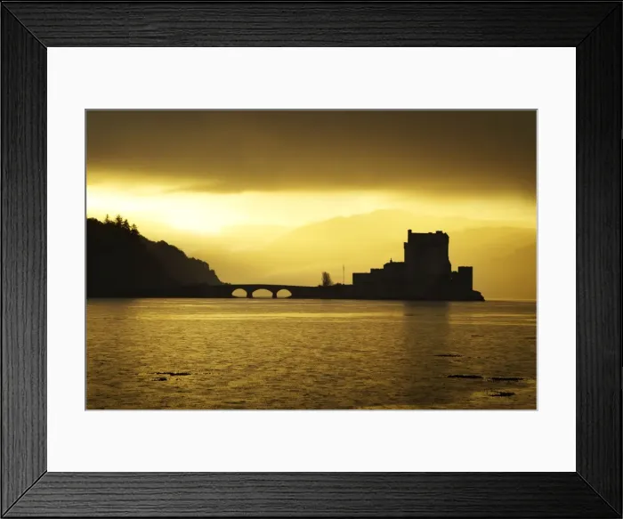 Framed Print : Eilean Donan Castle - being silhouetted in atmospheric conditions - November - Scotland Framed Print : Eilean Donan Castle - being silhouetted in atmospheric conditions - November - Scotland