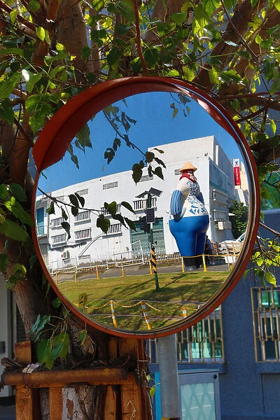13132473. Statue at the Pier 2 Art Center in a mirror, Kaohsiung City, Taiwan Date