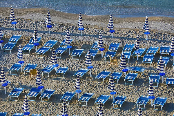 13132525. Beach chairs and umbrellas on the beach at Vietri Sul Mare