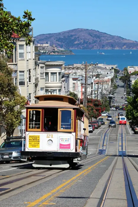 Framed Print : 13132534. Street scene with a Cable Car tram and Alcatraz Prison island in San Franciso Framed Print : 13132534. Street scene with a Cable Car tram and Alcatraz Prison island in San Franciso