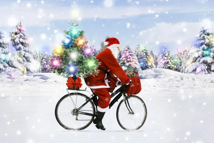 Framed Print : 13132615. Father Christmas riding bicycle through winter snow scene Date Framed Print : 13132615. Father Christmas riding bicycle through winter snow scene Date