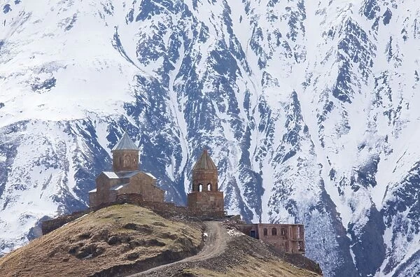 14th century Gergeti Trinity Church (Georgian Orthodox) high in the mountains above Stepantsminda