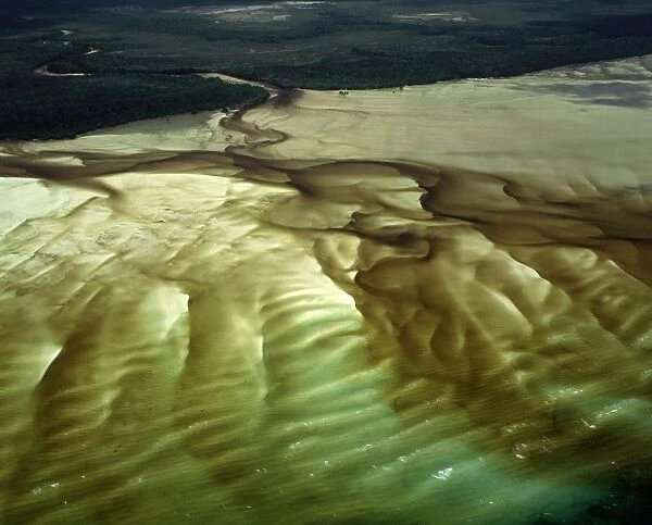 Aerial - A bay with shallow water revealing patterns in the white sand, Cape Grenville (not far from Shelburne Bay), Cape York Peninsula, Queensland, Australia JPF55034