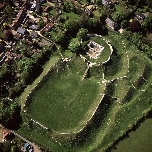 Aerial image of East Anglia, England, UK: Castle Acre Castle, remains of a motte-and-bailey castle, with extensive earthworks, Castle Acre, Norfolk