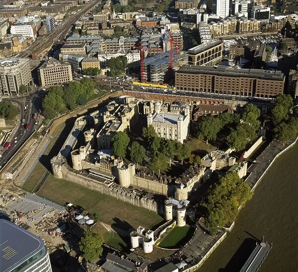 Aerial image of London, England, UK: Tower of London (Her Majesty's Royal Palace and Fortress), a historic fortress and scheduled monument on the north bank of the River Thames