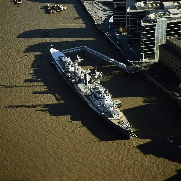 Aerial image of London, England, UK: HMS Belfast, a Royal Navy's Town-class cruiser, on the River Thames