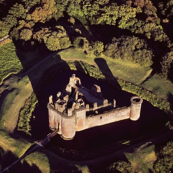 Aerial image of Scotland, UK: Caerlaverock Castle, a 13th-century triangular moated castle in the Caerlaverock National Nature Reserve area at the Solway Firth, Glencaple, Dumfries and Galloway