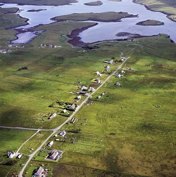 Aerial image of Scotland, UK: Callanish, a village (township), situated on a headland jutting into a sea loch, Loch Roag, near Stornoway, West Side of the Isle of Lewis, Outer Hebrides, West Coast Scotland