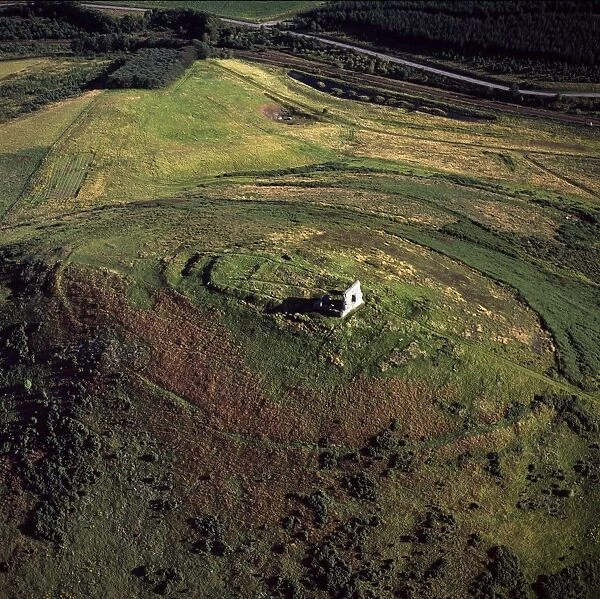 Aerial image of Scotland, UK: Dunnideer Castle, a 13th century tower house, built partially from the remains of an existing vitrified hill fort, Aberdeenshire, Scotland