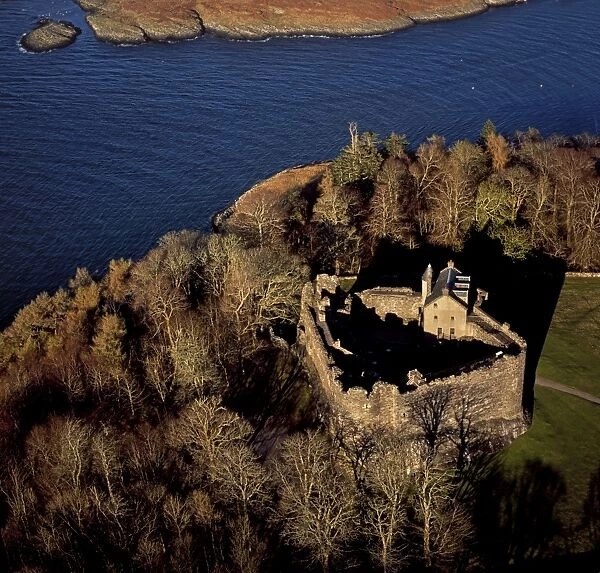 Aerial image of Scotland, UK: Dunstaffnage Castle, a partially ruined 13th century castle, situated on a platform of conglomerate rock on a promontory at the south-west of the entrance to Loch Etive, surrounded on three sides by the sea, near Oban