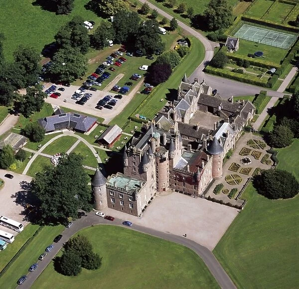 Aerial image of Scotland, UK: Glamis Castle, was the childhood home of Elizabeth Bowes-Lyon (the Queen Mother), village of Glamis, Angus, Scotland