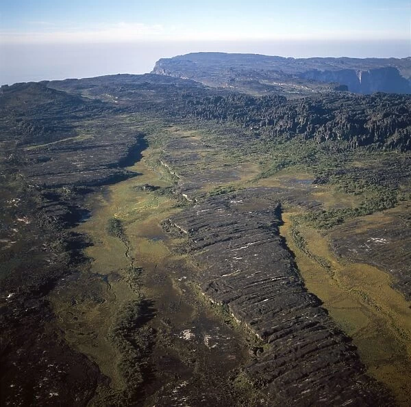 Aerial image of Tepuis, Venezuela, South America: Mount Roraima, swamps and rock labyrinths on summit plateau in Brazilian and Guyanese sectors
