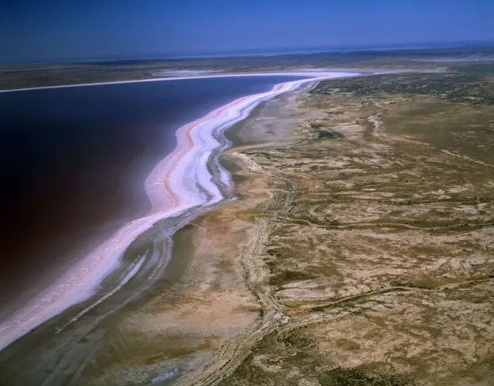 Framed Print : Aerial - Lake Eyre North Dry salt lake that floods a few times each century. Jackboot Bay, along Hunt Peninsula (Elliot Price Conservation Park) fills with pink tinted water (algae) Lake Eyre National Park, South Australia JPF46509