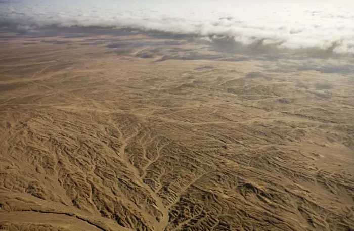 Framed Print : Aerial view of mist rolling in from the cold Atlantic Ocean over the Namib Desert Plains - Namib Desert - Namibia - Africa Framed Print : Aerial view of mist rolling in from the cold Atlantic Ocean over the Namib Desert Plains - Namib Desert - Namibia - Africa