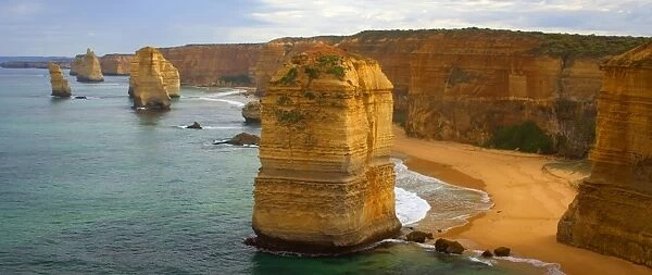 Twelve Apostles - morning at the sandstone rock formations of famous Twelve Apostels, which are sculpted by the relentless sea. The force of the sea eats more and more of the rocks away