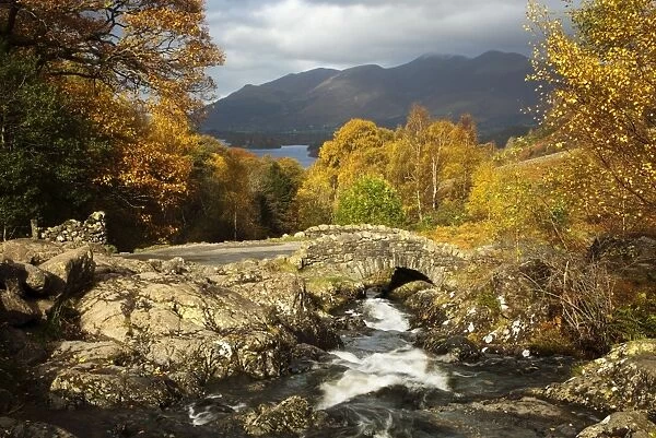 Ashness Bridge in autumn looking towards Derwent Water and the mountains of Skiddaw - Lake District - England