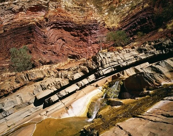 Australia South Fortescue river flows through ironstone strata. Hamersley Gorge National Park, Pilbara region, Western Australia