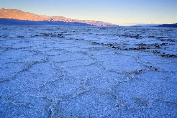Badwater - the salt flats of Badwater, the lowest point in the whole US, at sunrise. The structures of the salt crystals are clearly visible - Death Valley National Park, California, USA
