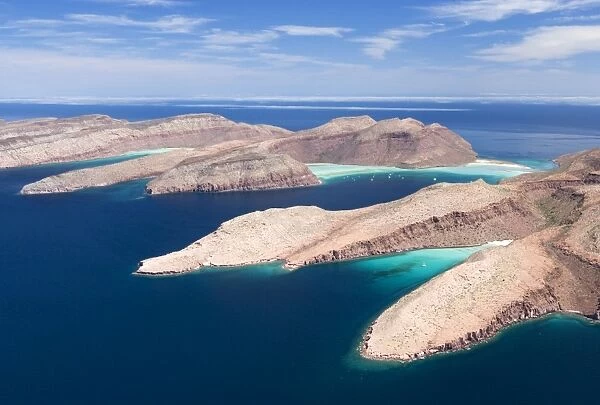 Baja California South, and Sea of Cortez, Mexico: Aerial view of two islands of the Bay of La Paz: Espiritu Santo and Partida, separated by a narrow channel