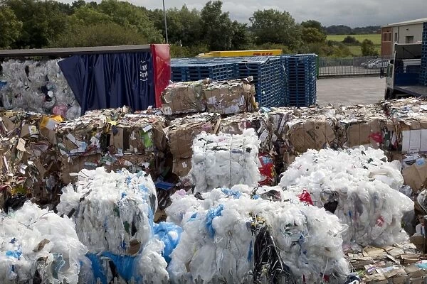 Bales of plastic and cardboard waste for recycling outside Morrisons warehouse Bristol UK