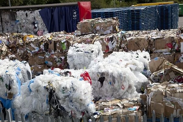 Bales of plastic and cardboard waste for recycling outside Morrisons warehouse Bristol UK