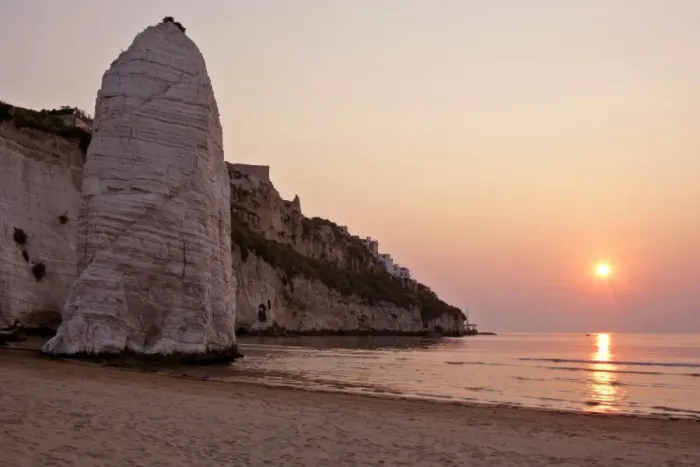 Framed Print : Beach of Vieste with chalk cliffs and symbol Pizzomunno at sunrise Gargano Peninsula, Italy Framed Print : Beach of Vieste with chalk cliffs and symbol Pizzomunno at sunrise Gargano Peninsula, Italy