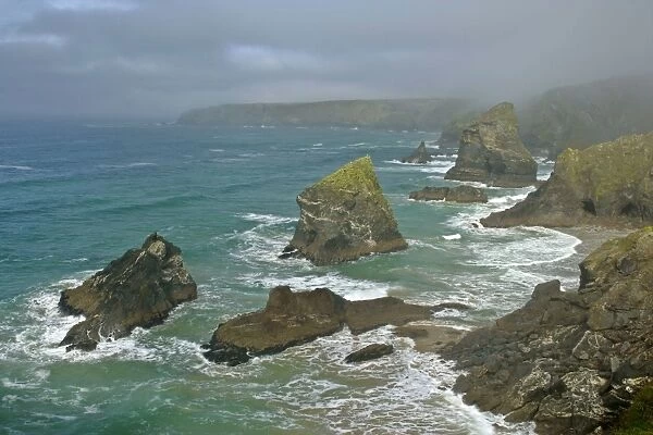 Bedruthan Steps overview over rugged coastline and sea stacks Cornwall, England, UK