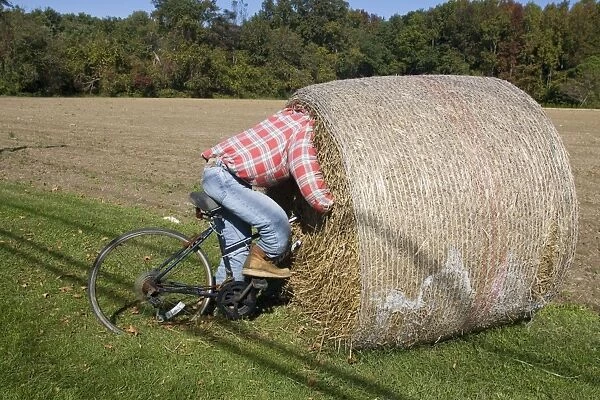 Bike Riding into hay bail