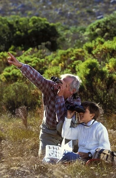 Birdwatching - adult and child with binoculars