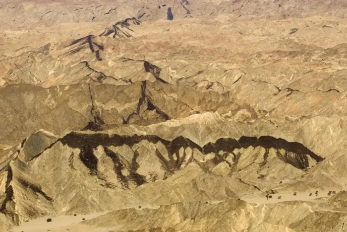 Framed Print : Black dolerite dykes clearly visible as they cut through the rocky terrain of the Moon Valley near Swakopmund - Namib Desert - Namibia - Africa
