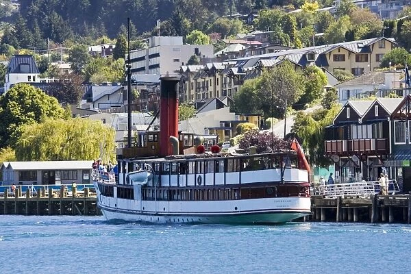 Boat - Vintage steamship TSS Earnslaw moored at quayside Lake Wakatipu Queenstown New Zealand. This elegant steamship is the last remaining coal-fired passenger vessel and a popular choice for tourists