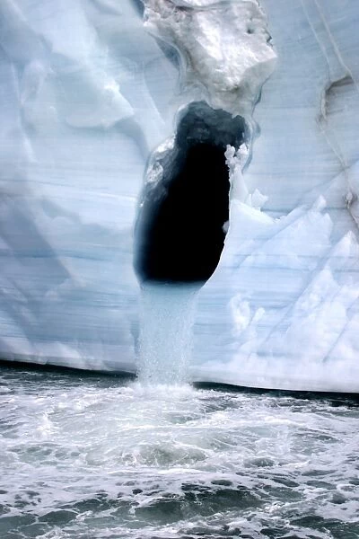 Brasvell's Glacier - waterfall pouring from ice cave Nordaustlandet. Svalbard