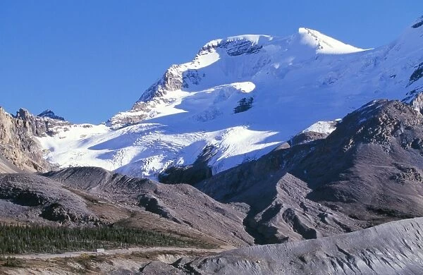 Canada - Glacial deposits at snout of retreating glacier. Road below Mount Athabasca with Bus showing scale (3490 m)