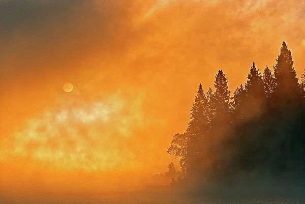 Canada, Manitoba, Whiteshell Provincial Park. Foggy sunrise over Caddy Lake. Date: 21-09-2013