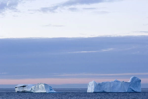 Canada, Nunavut. Icebergs at sunset in Davis