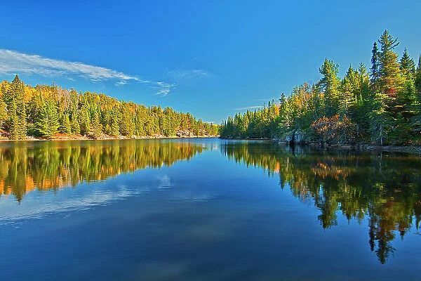 Canada, Ontario. Forest reflections on Blindfold Lake in autumn. Date: 10-10-2020