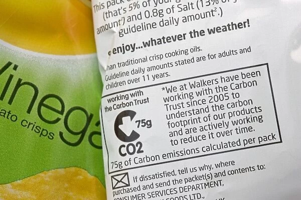 Carbon emissions label on Walkers Salt and vinegar crisp packet whose carbon footprint has been worked out in cooperation with the Carbon Trust UK