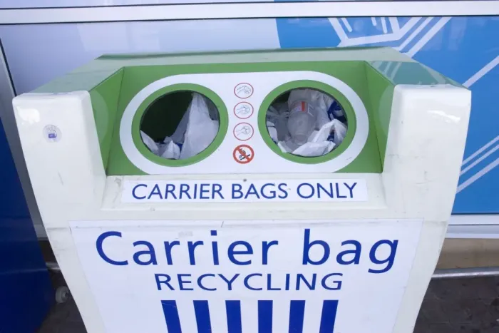 Framed Print : Carrier bag recycling container outside Tesco food store for disposing of plastic bags. Tesco does not charge customers for plastic carrier bags but has recently changed to using biodegrradable plastic Framed Print : Carrier bag recycling container outside Tesco food store for disposing of plastic bags. Tesco does not charge customers for plastic carrier bags but has recently changed to using biodegrradable plastic