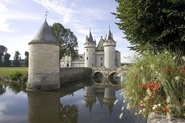 Chateau of Sully-sur-Loire, France - Towers of the classic medieval fortress of Chateau of Sully-sur-Loire. Built in the 14th century it is approached over a moat by a wooden walkway and drawbridge, France