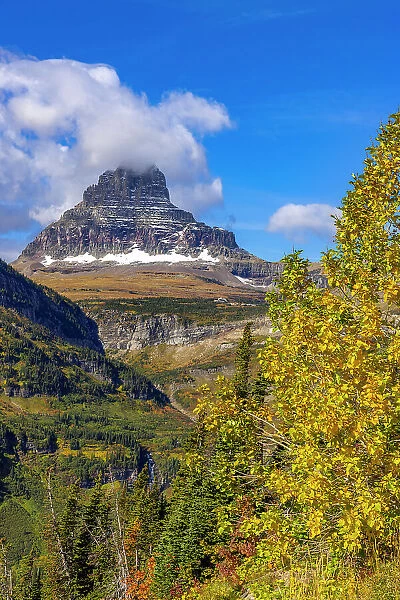 Clements Mountain and Reynolds Creek Falls in autumn, Glacier National Park, Montana, USA Date: 23-09-2021